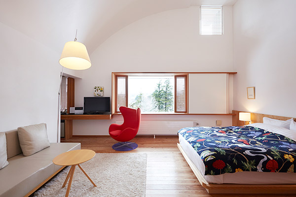 SUPERIOR ROOM (Room304) Warm modern texture of the natural woods of Scandinavian furniture perfectly matches the mountainscape viewed from the panoramic window.